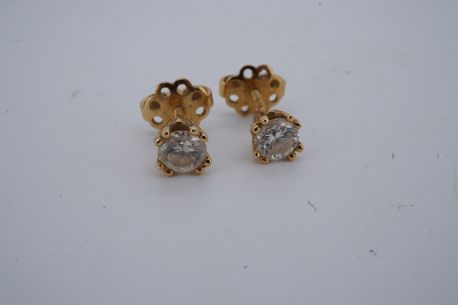 A pair of diamond ear studs, each weighing approximately 0.30 carats, mounted in gold, approximately 4.5mm diameter